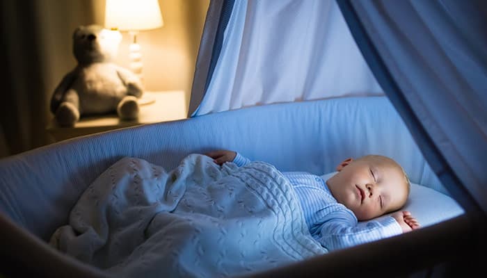 baby sleeping in a crib