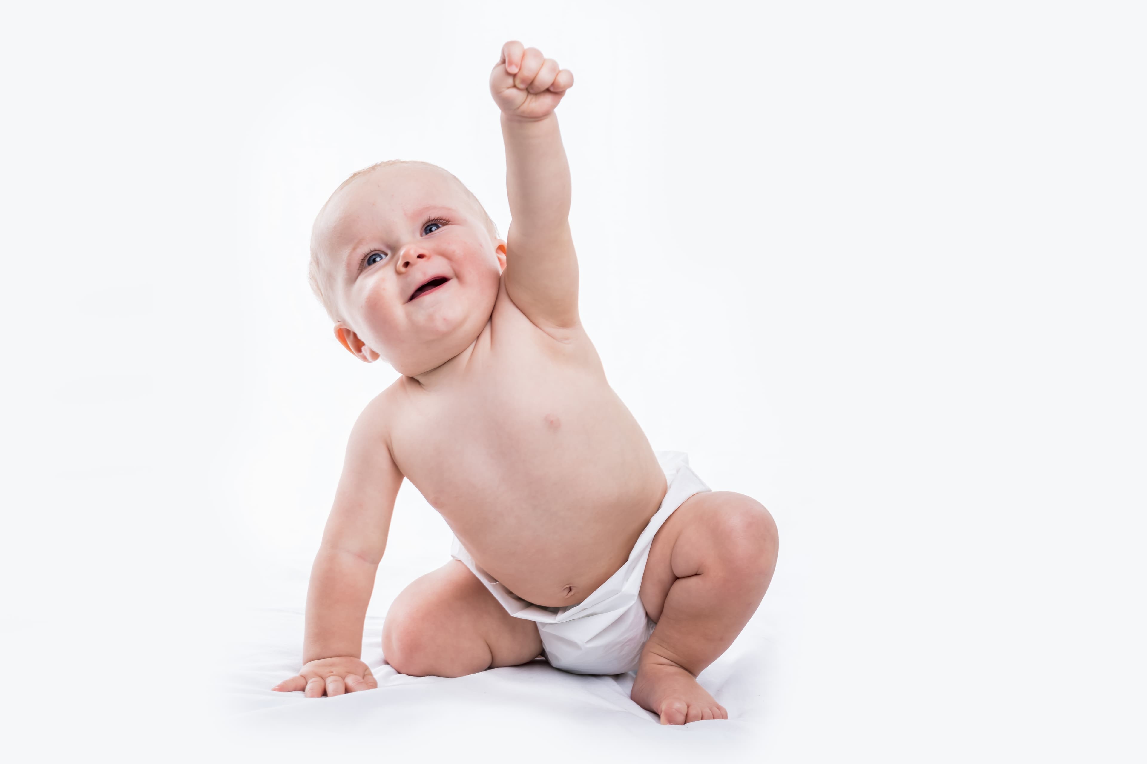 happy baby with raised arms