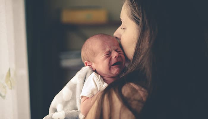 Sweet crying newborn baby